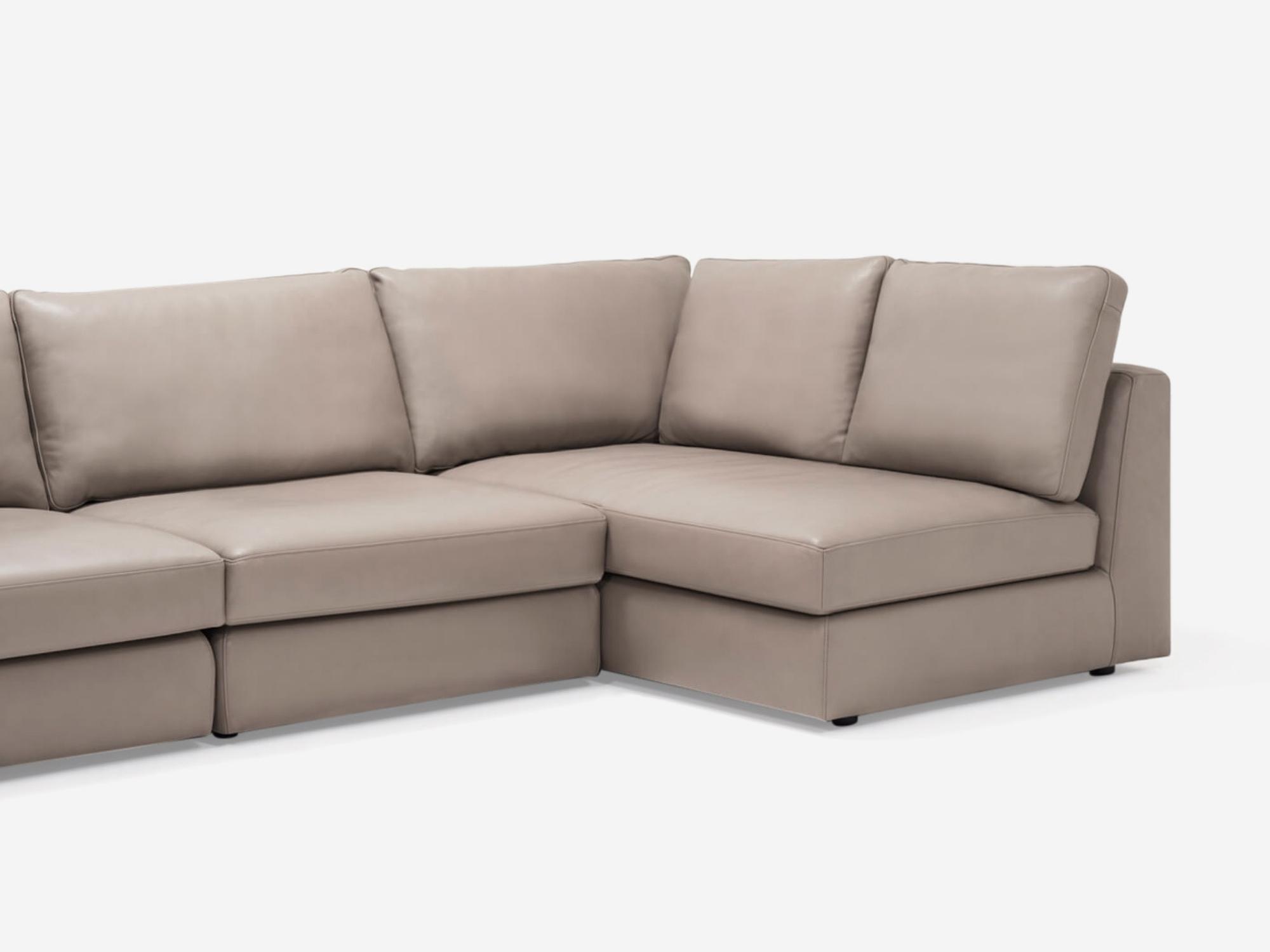 Detailed corner view of the Cello 3-piece sectional couch with full arm chaise in tan leather